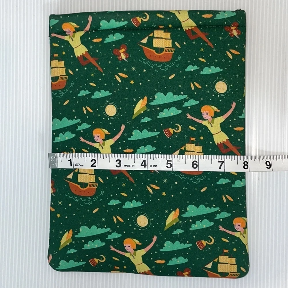 Padded tablet cover or book reader cover with Peter Pan print design